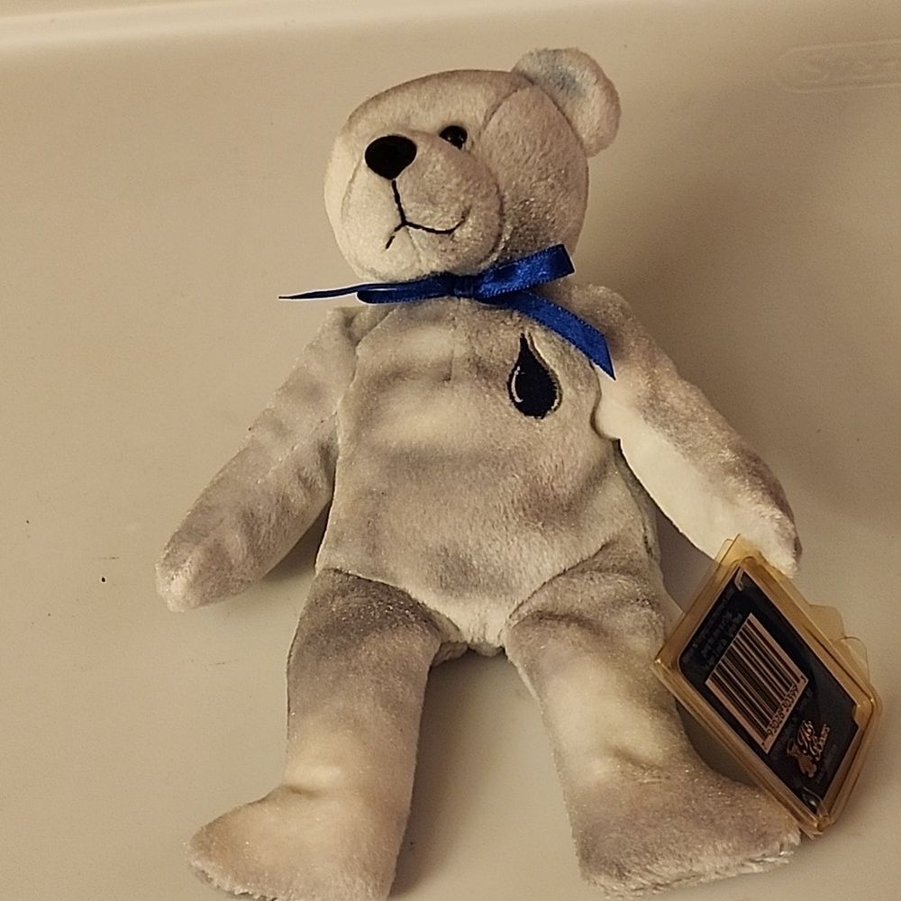 Gray and White Plush Bear with Blue Ribbon